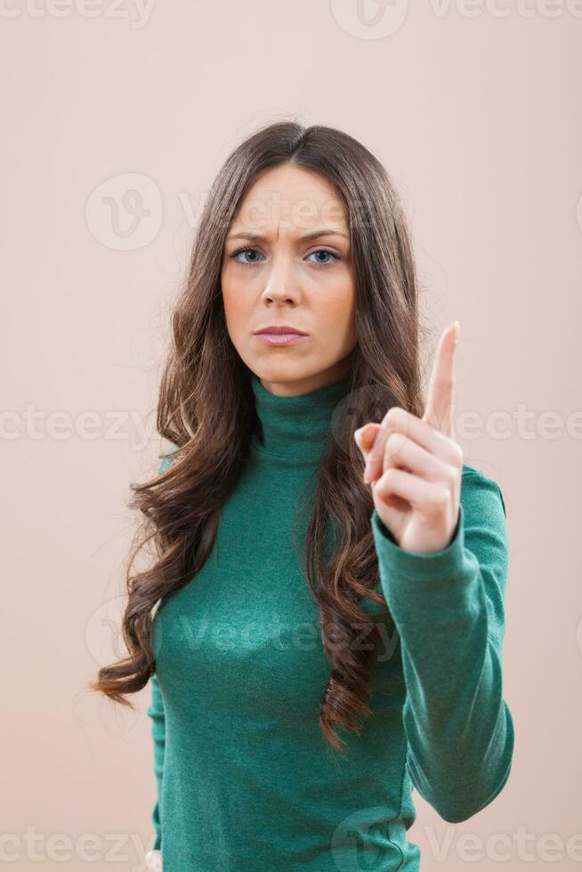 een vrouw met een groen blouse foto