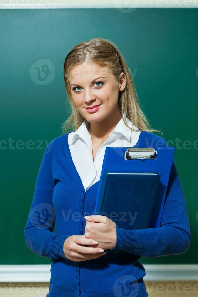 een college leerling meisje met een blauw Cardigan foto