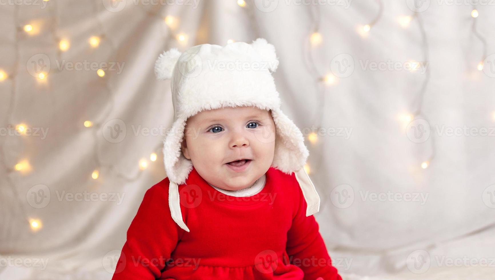 kerstbaby lacht foto