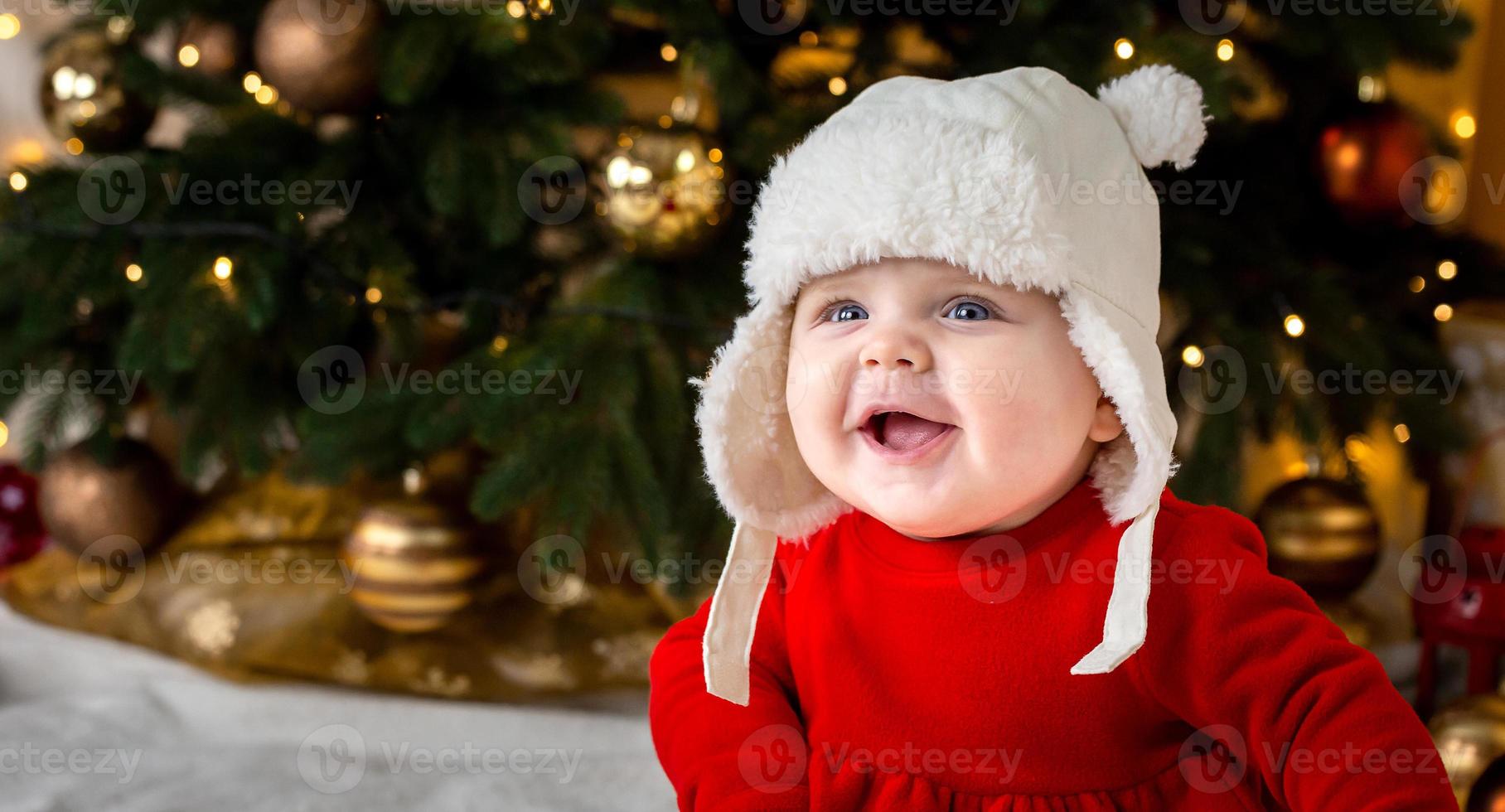 kerstbaby lacht foto