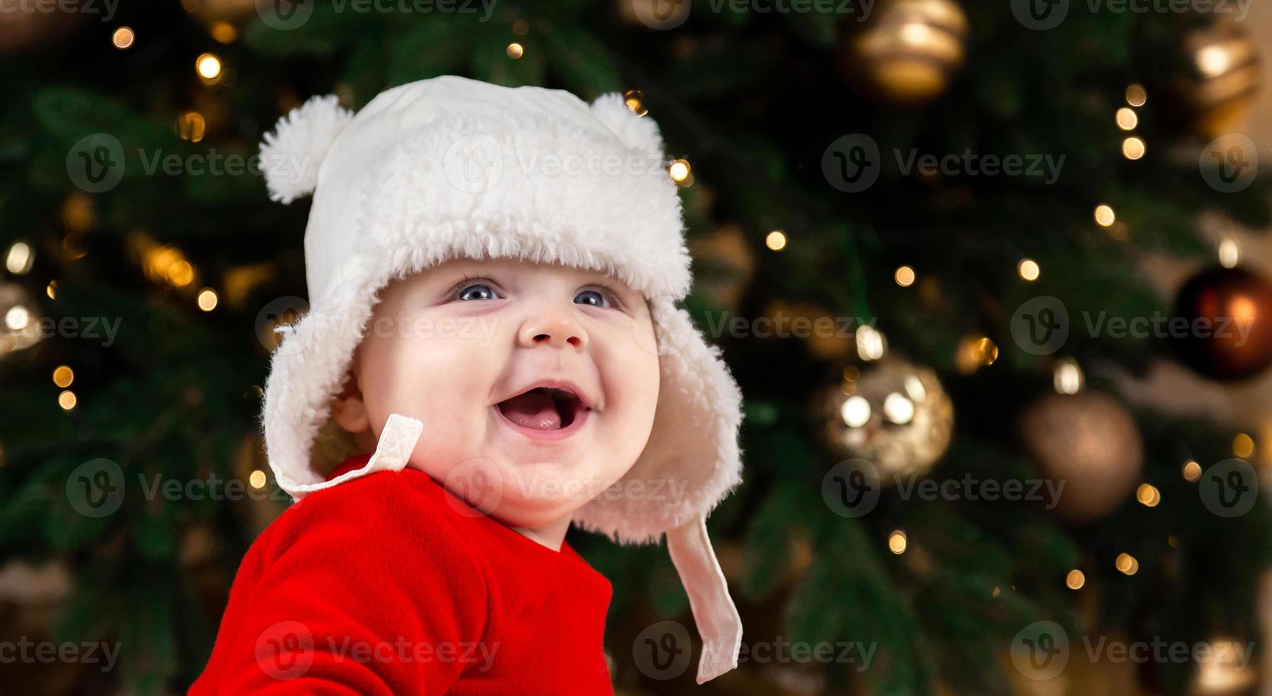 kerstbaby lacht foto