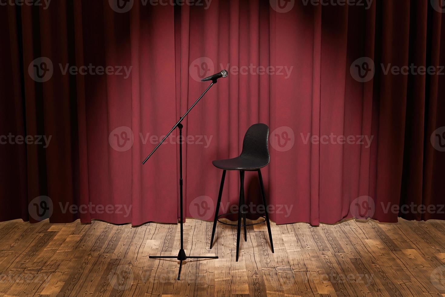 microfoon en krukje op een podium met gordijnen erachter foto