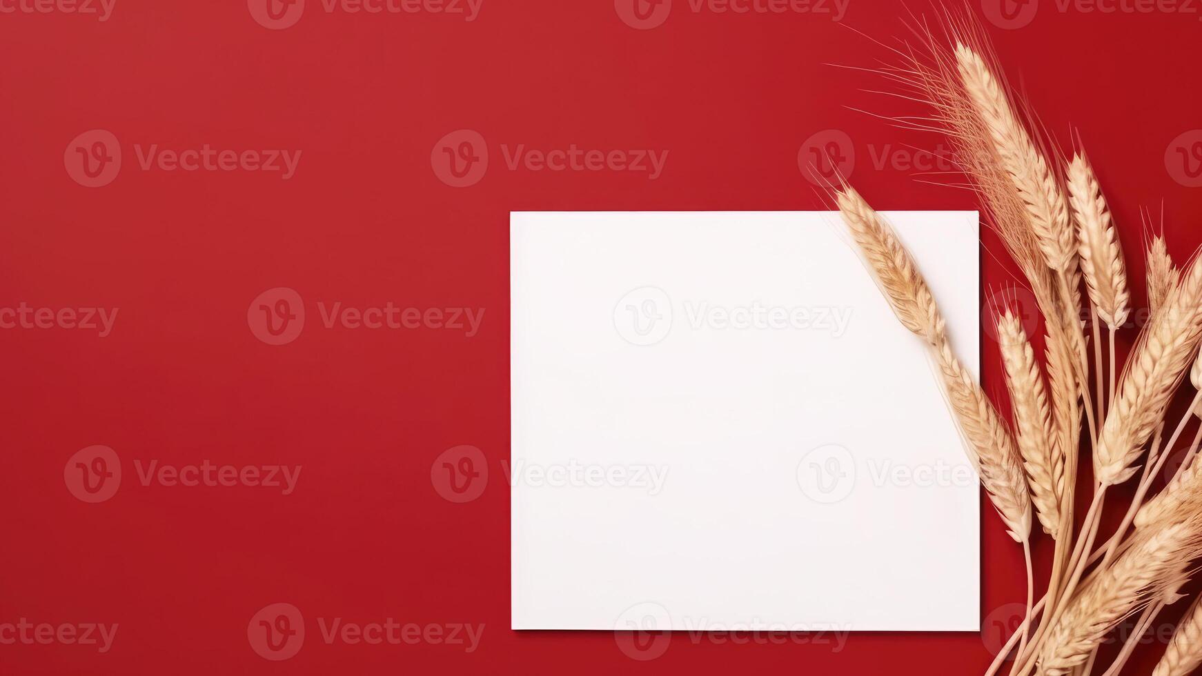 blanco wit papier en gouden droog tarwe gras Aan rood achtergrond. bruiloft kaart en ruimte voor uw bericht. generatief ai. foto