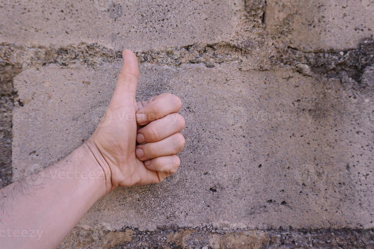 hand gebaren ok op de muur foto