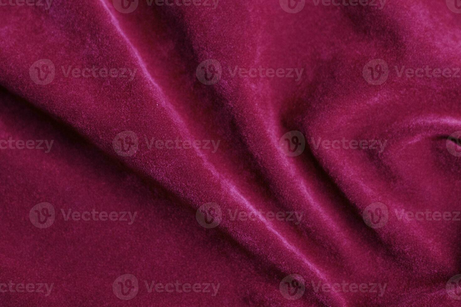 roze fluweel kleding stof structuur gebruikt net zo achtergrond. roze kleding stof achtergrond van zacht en glad textiel materiaal. Daar is ruimte voor tekst. foto