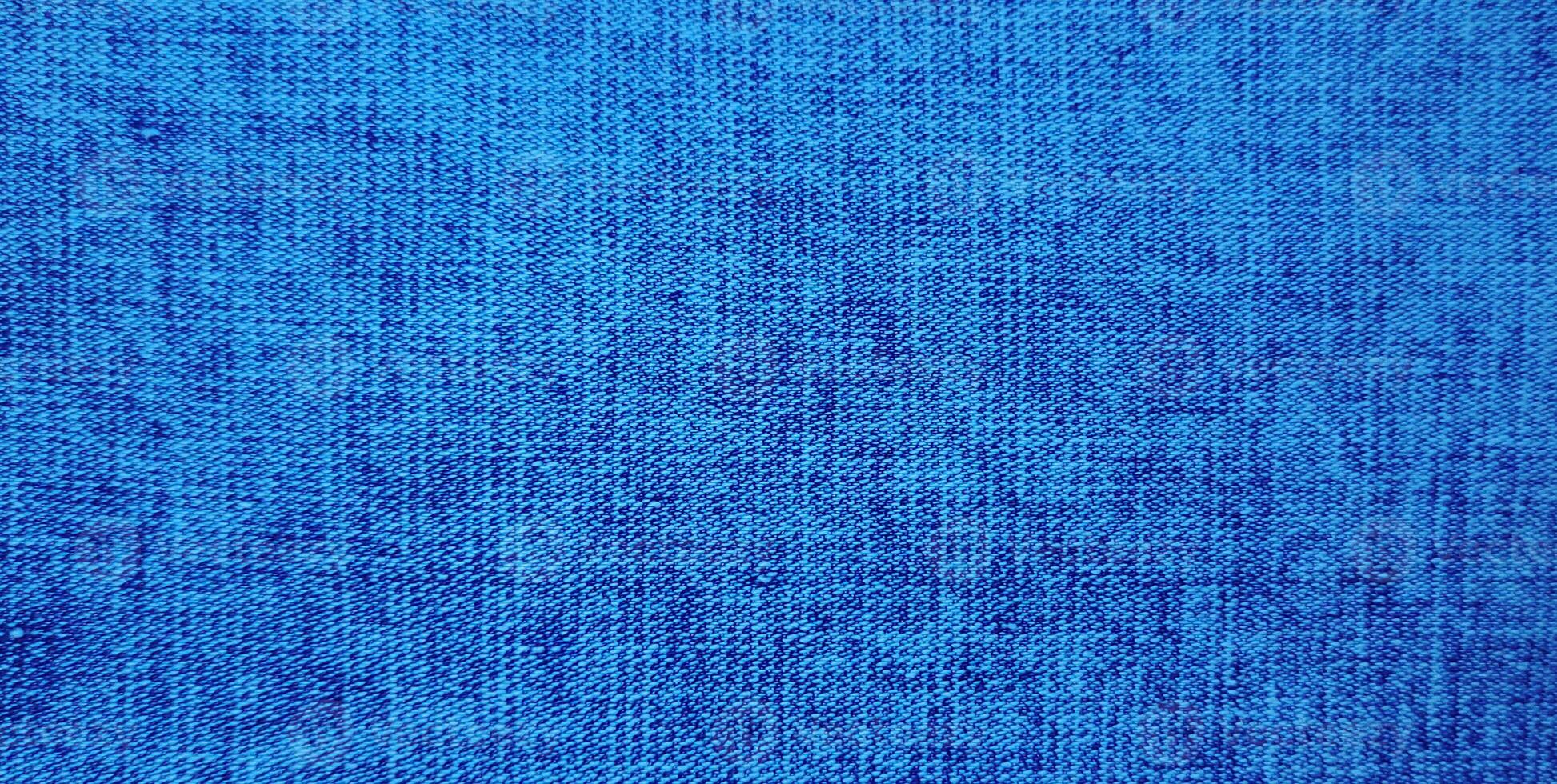 licht blauw kleur abstract denim jasje, wijnoogst denim jeans kleding en kleding stof dichtbij omhoog macro foto voor achtergrond