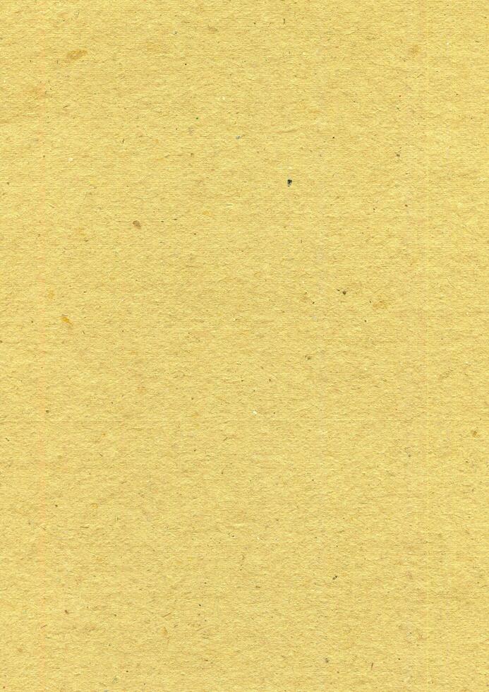 geel papier met korrelig structuur foto achtergrond. oud papier oppervlakte achtergrond.