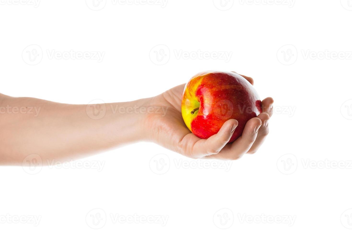 man met een rode appel in zijn hand. geïsoleerd op een witte achtergrond. foto