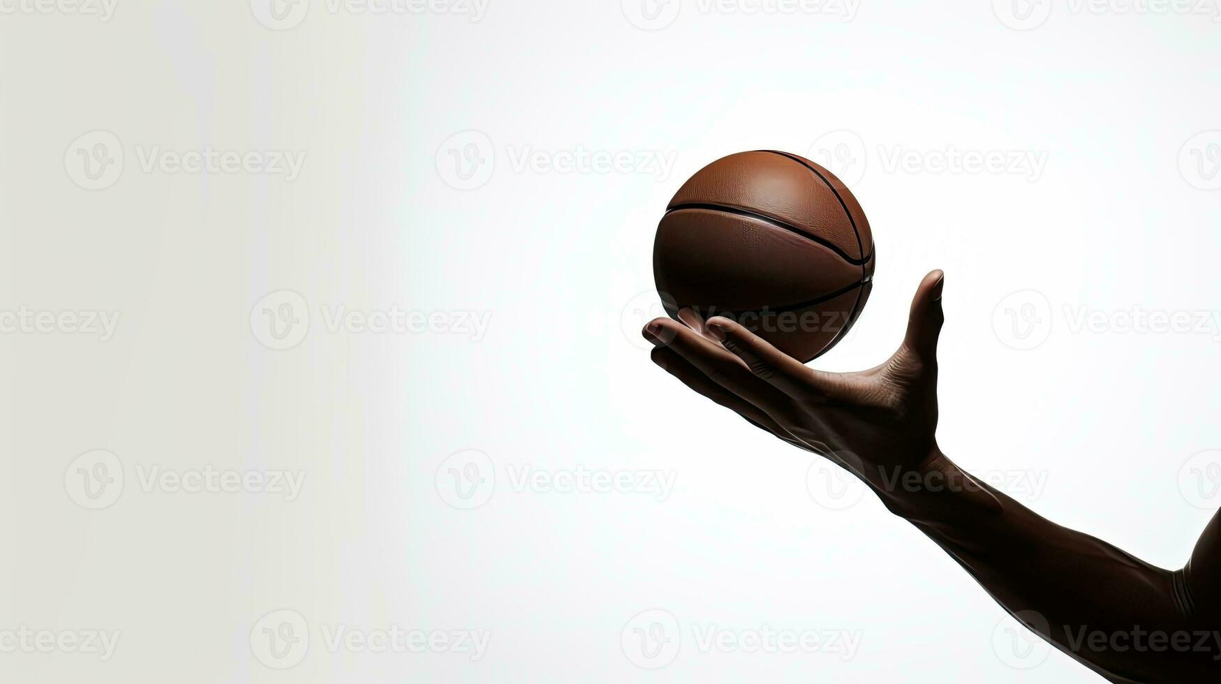 basketbal bal silhouet gehouden door hand- wit backdrop foto