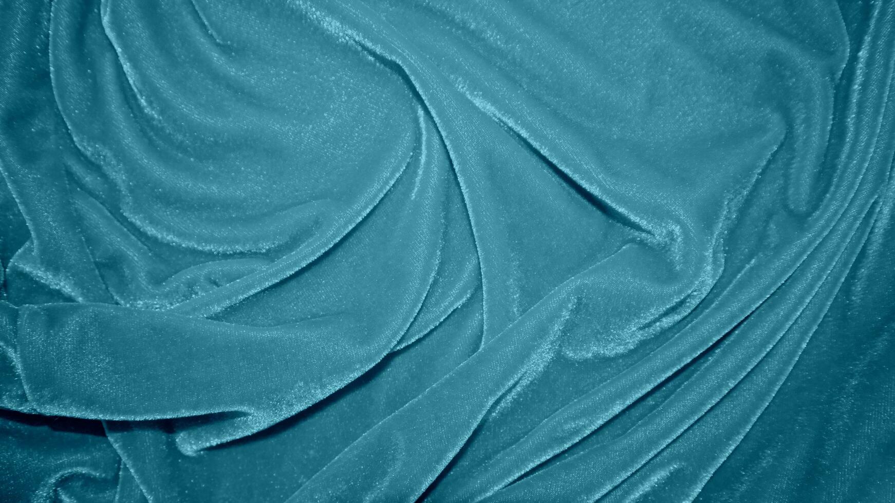 blauw fluweel kleding stof structuur gebruikt net zo achtergrond. oceaan kleur panne kleding stof achtergrond van zacht en glad textiel materiaal. verpletterd fluweel .luxe marine toon voor zijde. foto
