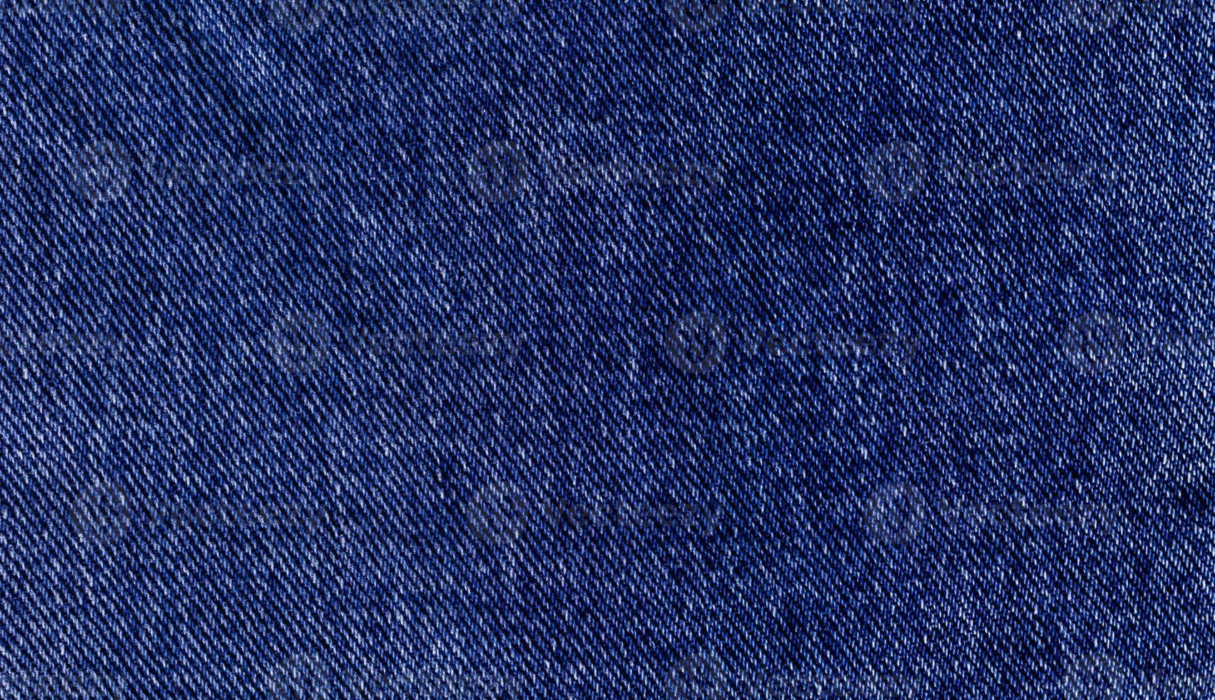 blauwe denim rechthoek, achtergrond van getextureerd jeansmateriaal foto