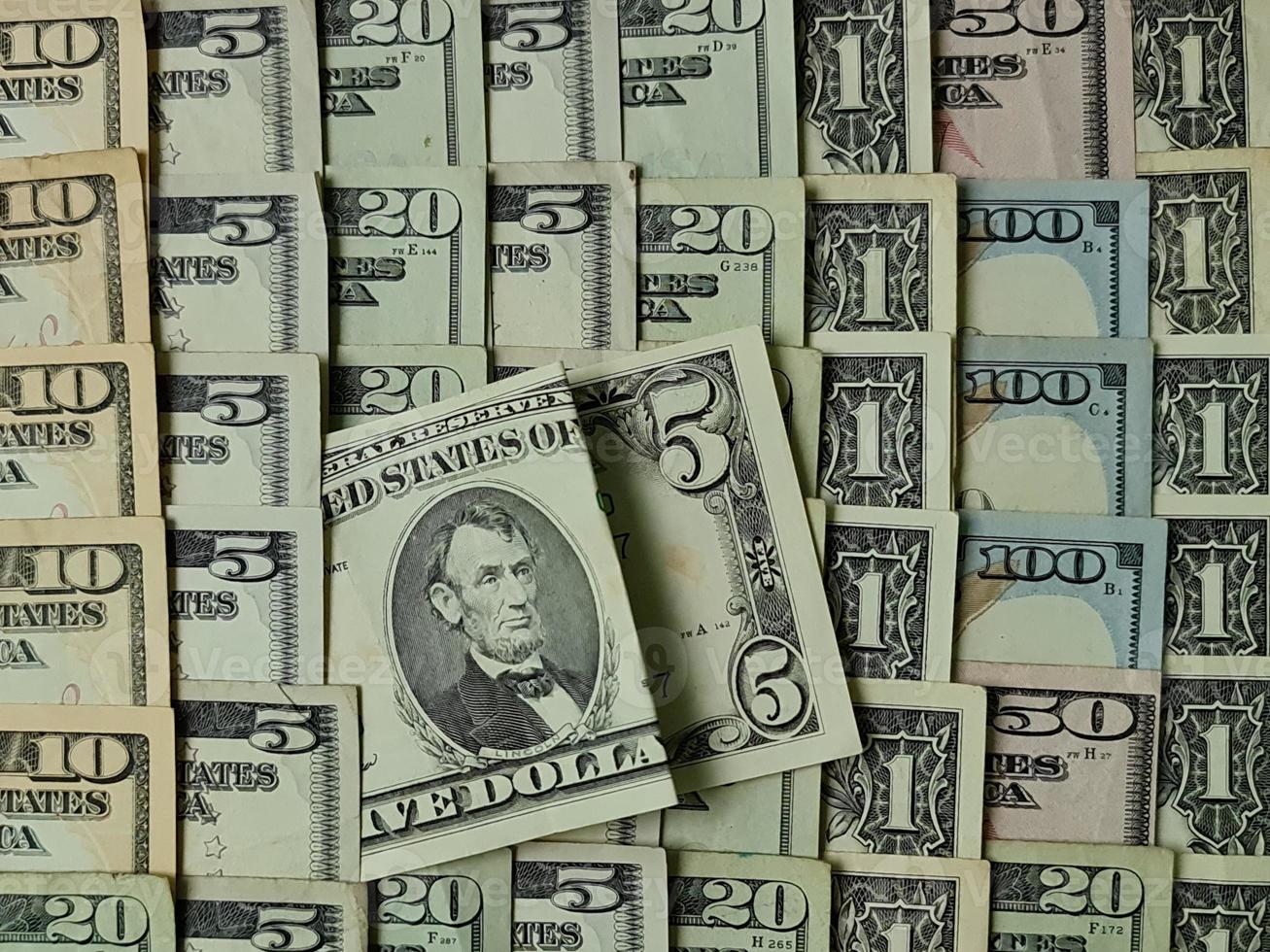 achtergrond voor economie- en financiële thema's met Amerikaans dollargeld foto