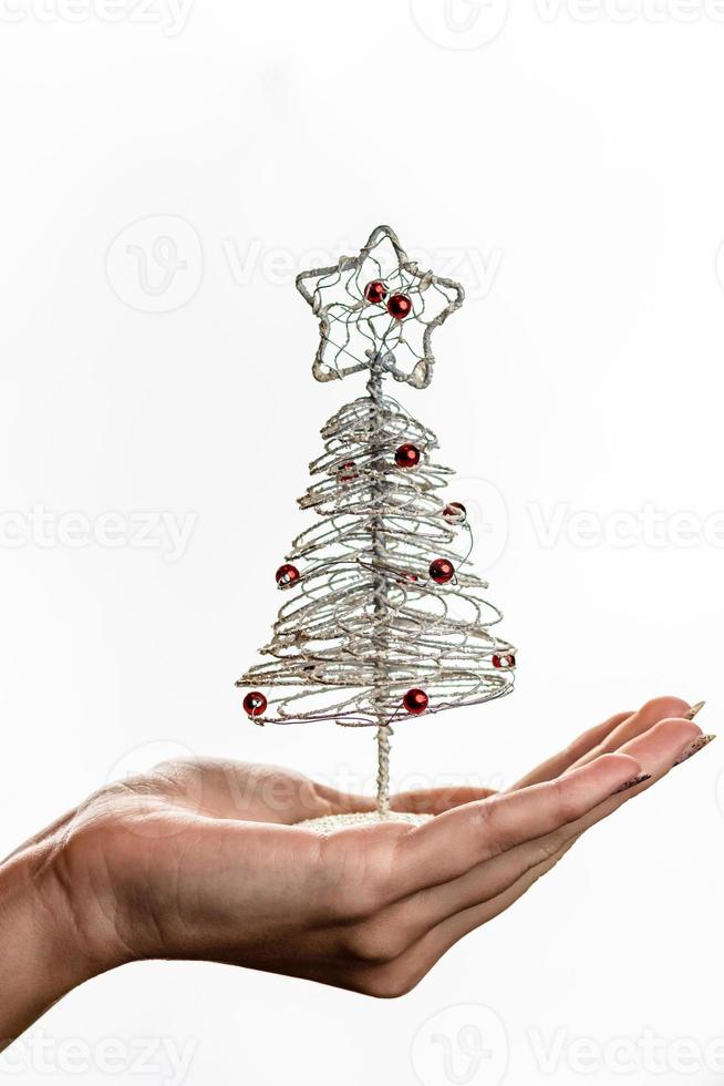 hand met kerstversiering foto