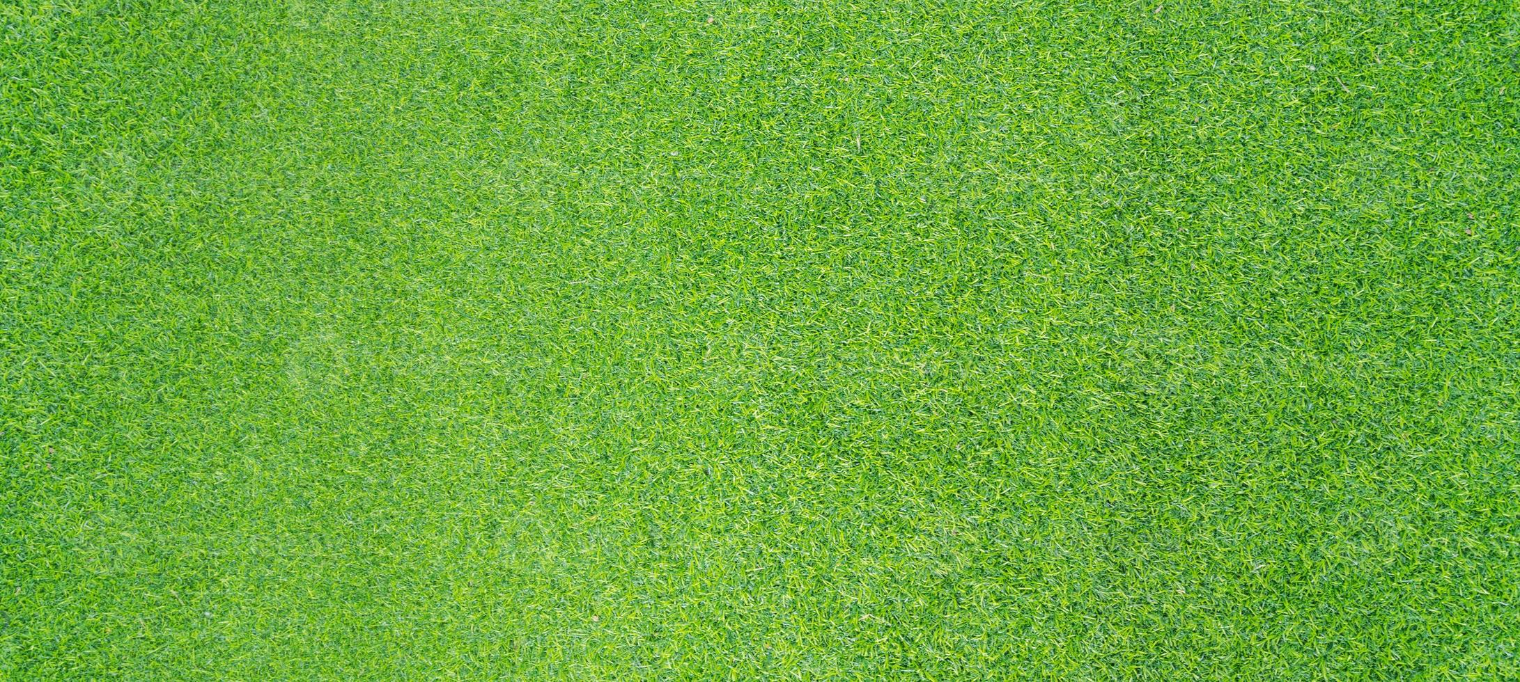 bovenaanzicht foto, kunstmatige groene gras textuur achtergrond foto