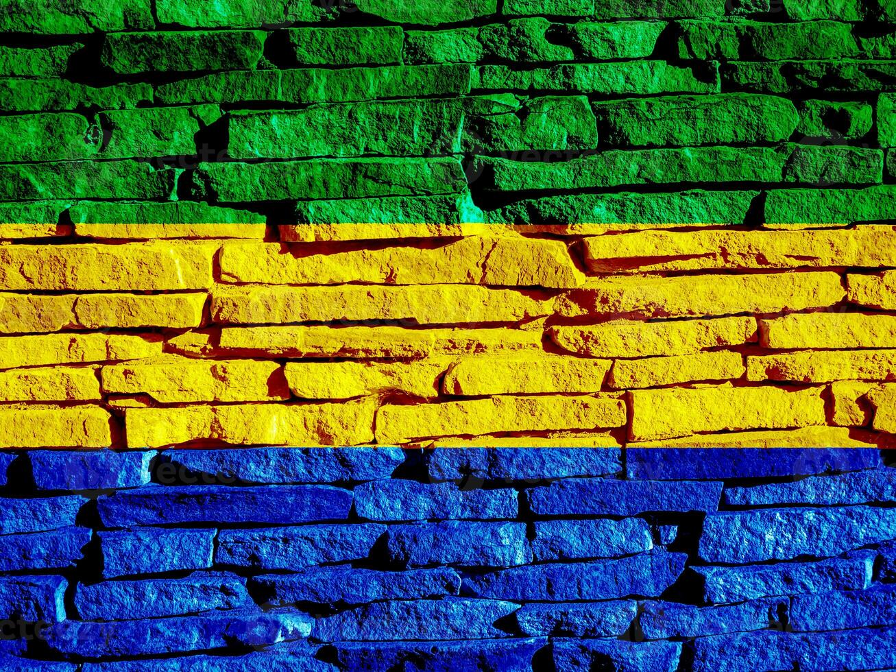 vlag van republiek van Gabon Aan een getextureerde achtergrond. concept collage. foto