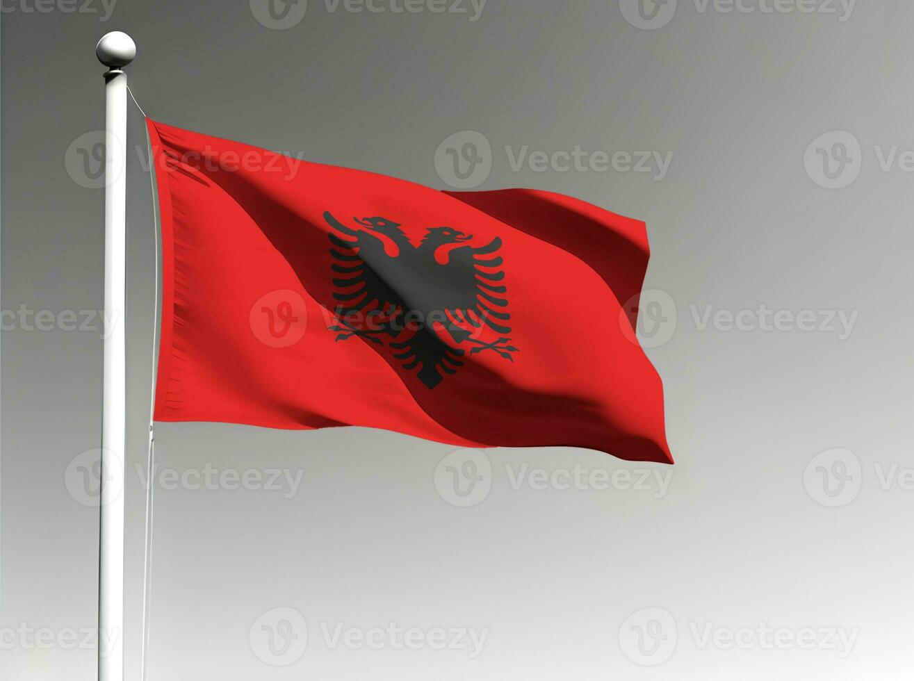 Albanië nationaal vlag golvend Aan grijs achtergrond foto