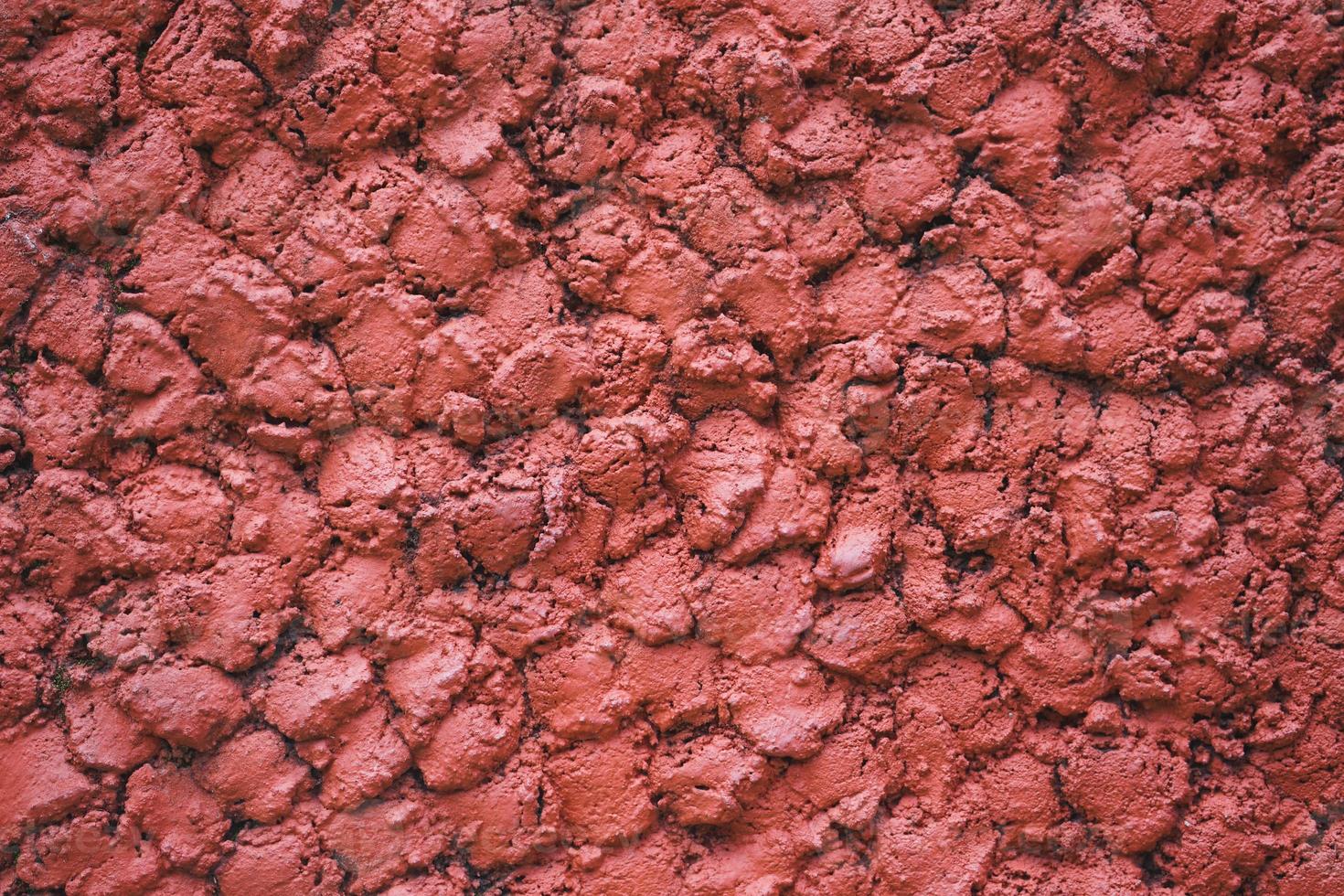 abstracte betonnen rode muur texturen achtergrond. achtergrond van een rood stucwerk gecoat en geschilderde buitenkant foto