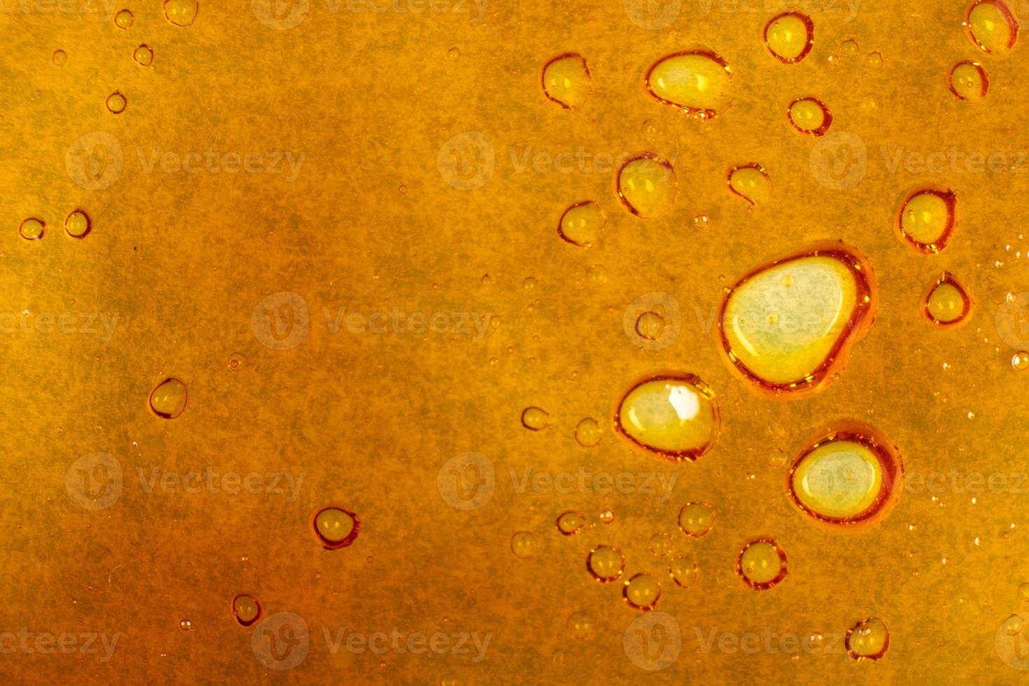 textuur gouden cannabis wax, marihuana schar macro achtergrond foto