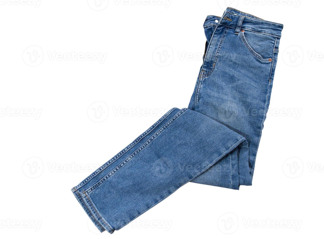 mannen vrouwen jeans geïsoleerd. gevouwen trendy blauwe jeans broek geïsoleerd foto