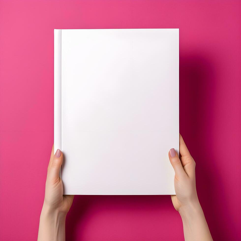 vrouw hand- Holding boek met blanco Hoes Aan roze achtergrond, top visie. generatief ai foto