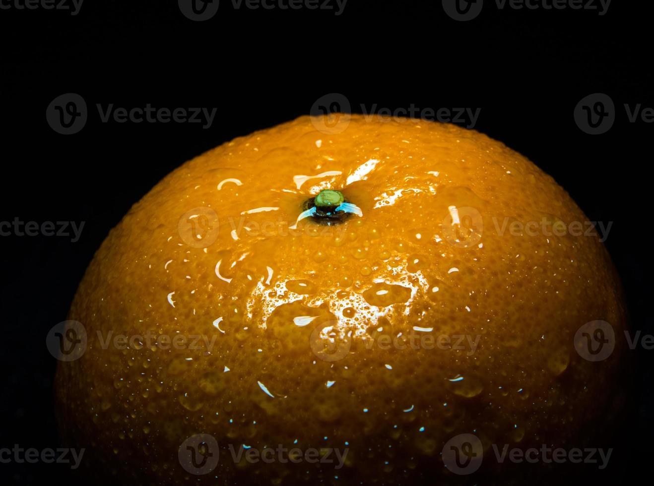 waterdruppel op glanzend oppervlak van vers oranje fruit foto