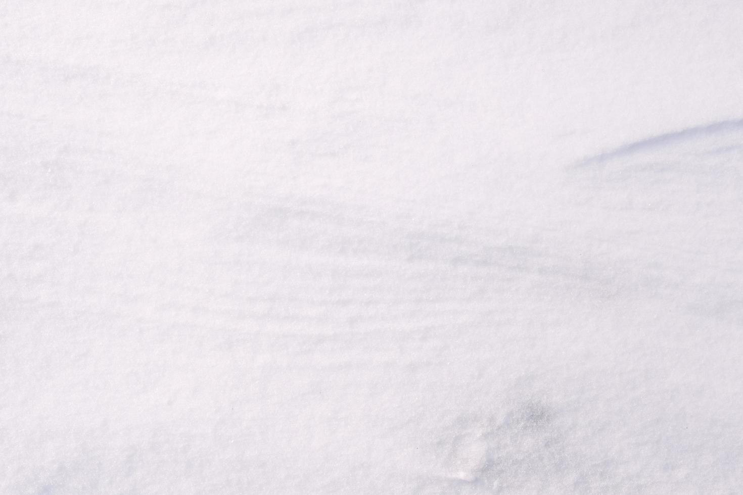 getextureerde sneeuwbankclose-up, schone witte sneeuwtextuur foto