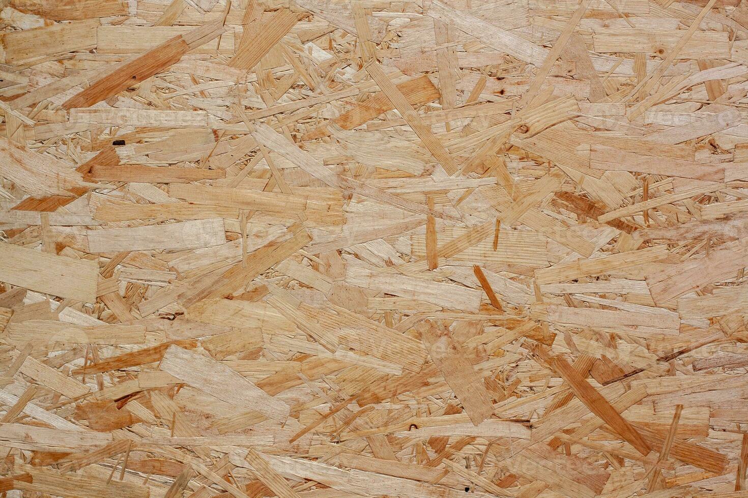 osb bord textuur. hardboard hout textuur. de structuur van de ingedrukt hout spaanplaat. foto