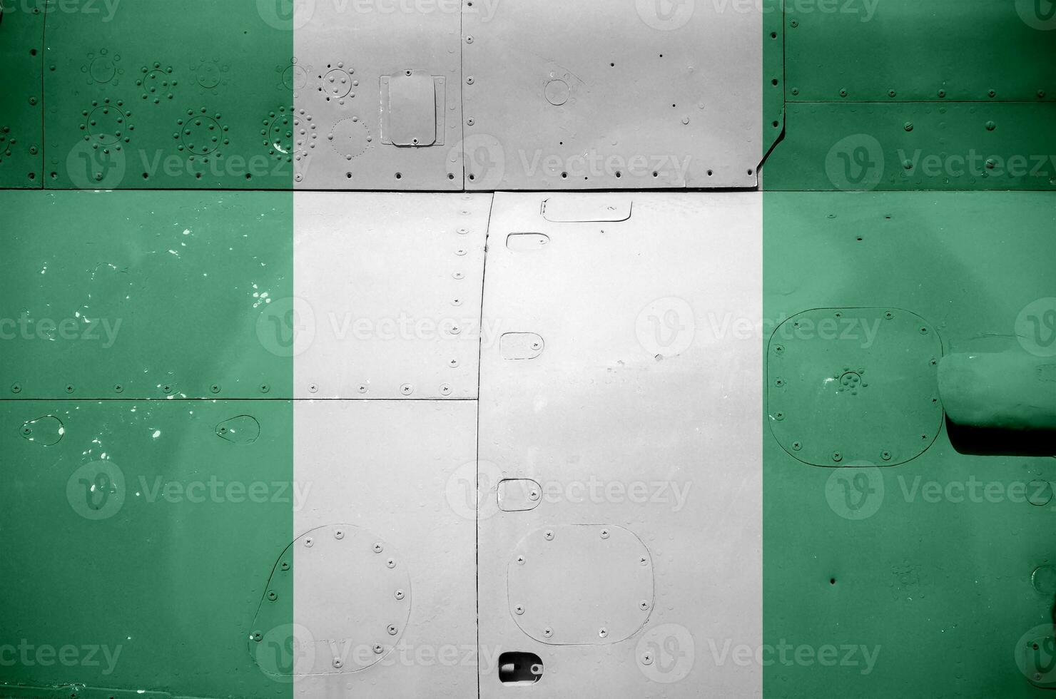 Nigeria vlag afgebeeld Aan kant een deel van leger gepantserd helikopter detailopname. leger krachten vliegtuig conceptuele achtergrond foto