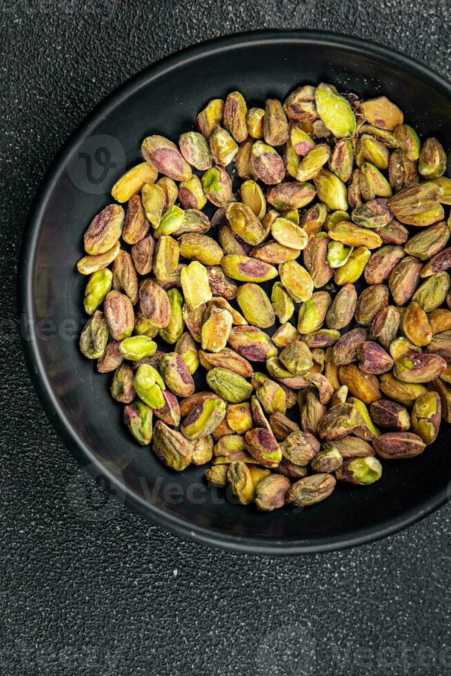 pistachenoten geschild zonder schelp heerlijk noot heerlijk gezond aan het eten Koken voorafje maaltijd voedsel tussendoortje Aan de tafel foto