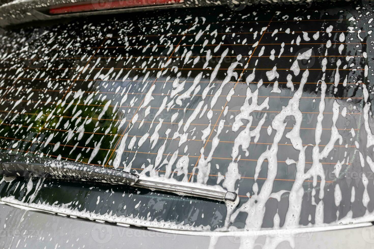 auto schoonmaak en het wassen met schuim zeep foto