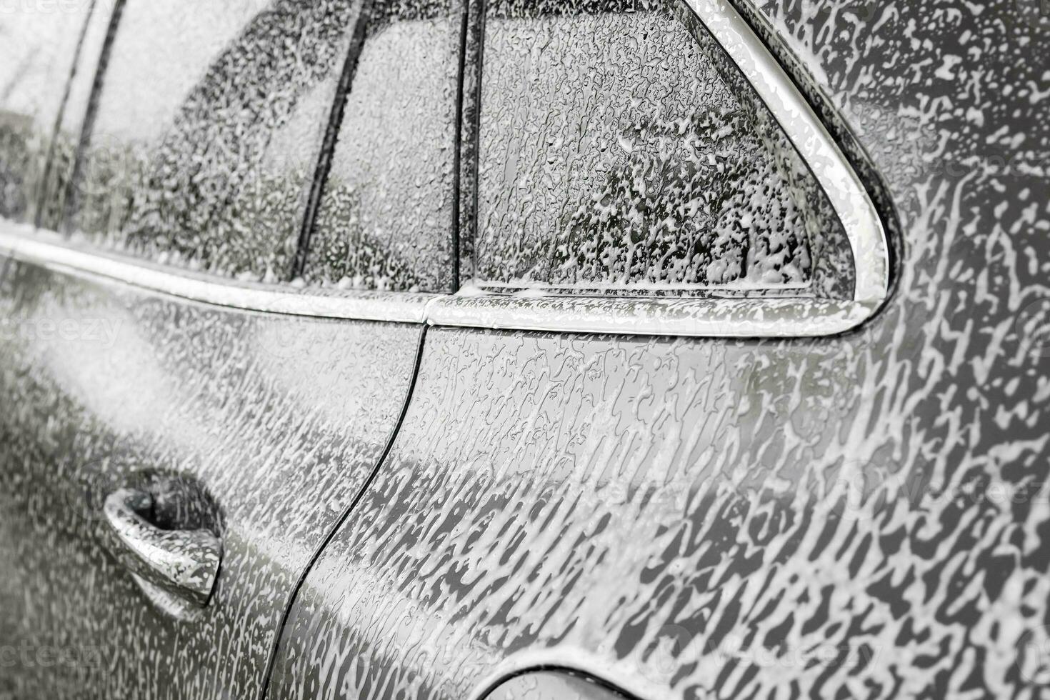 auto schoonmaak en het wassen met schuim zeep foto