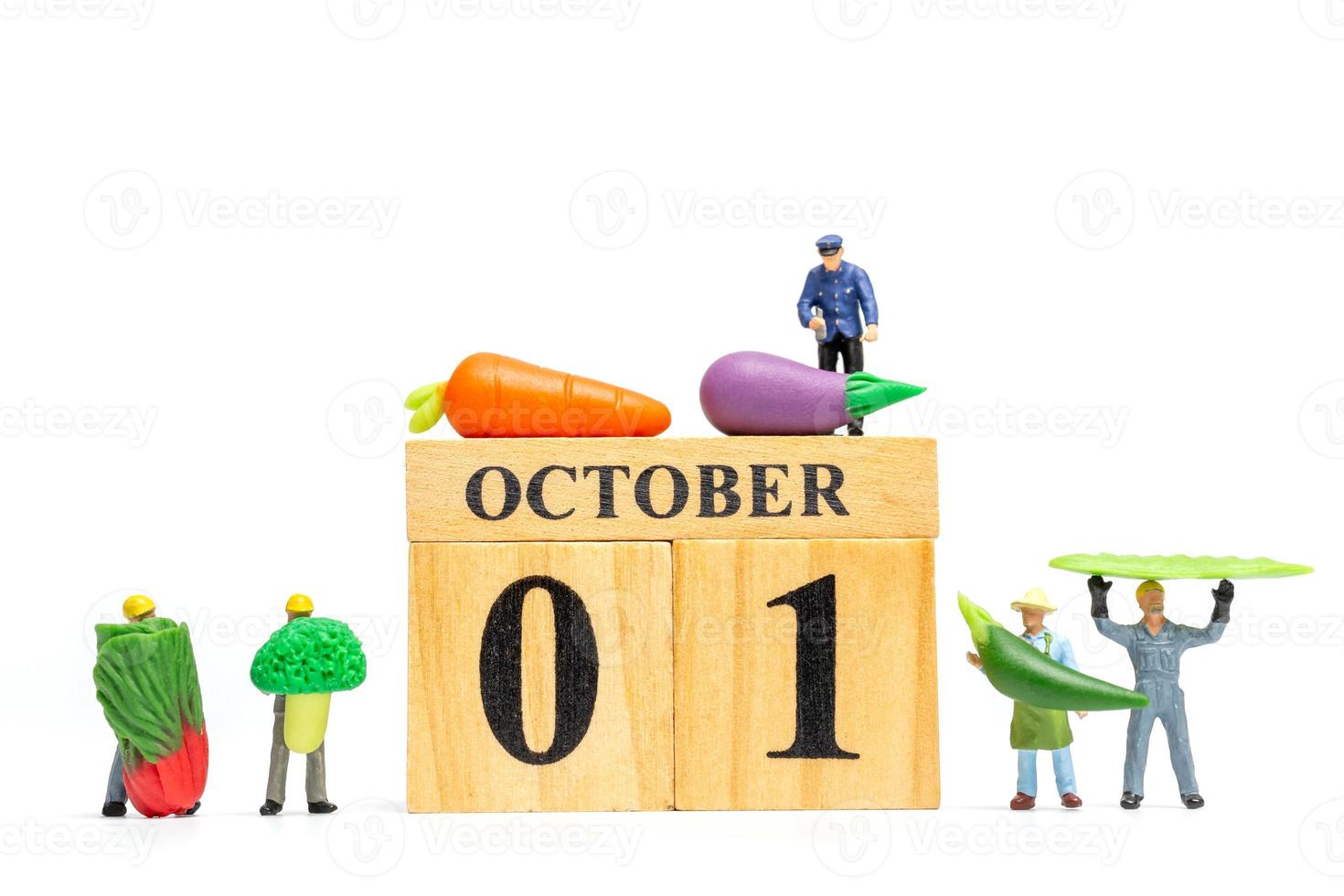 miniatuur mensen landbouw bezig met hout kalender 1 oktober foto