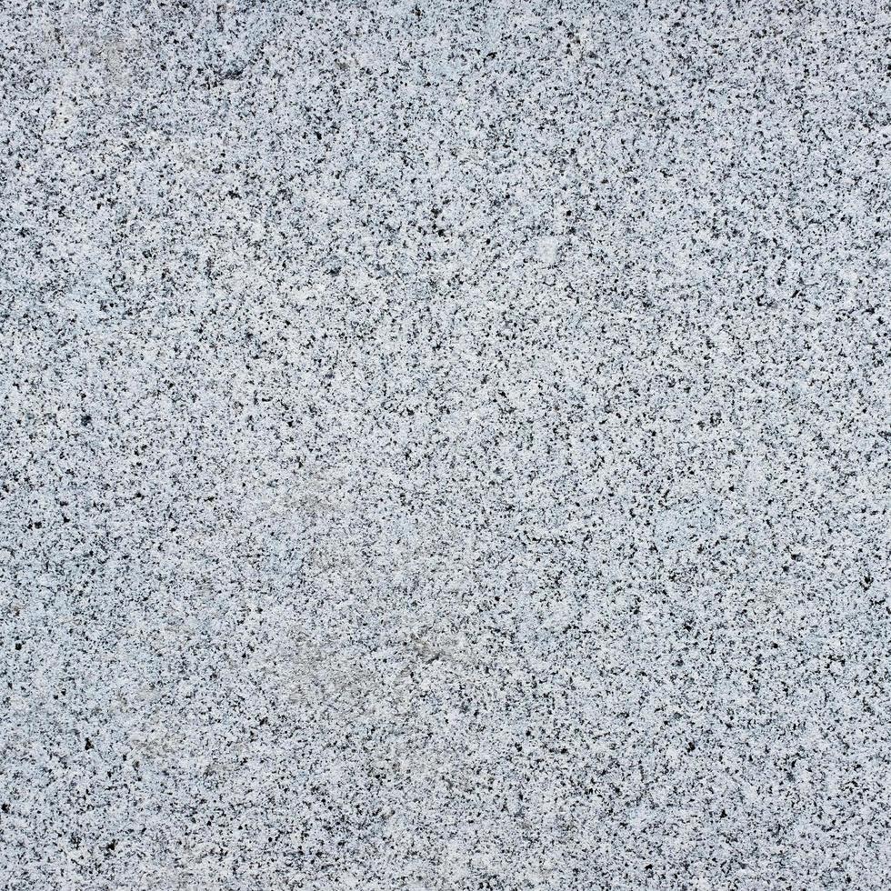 naadloze donkergrijze granieten steen textuur. foto