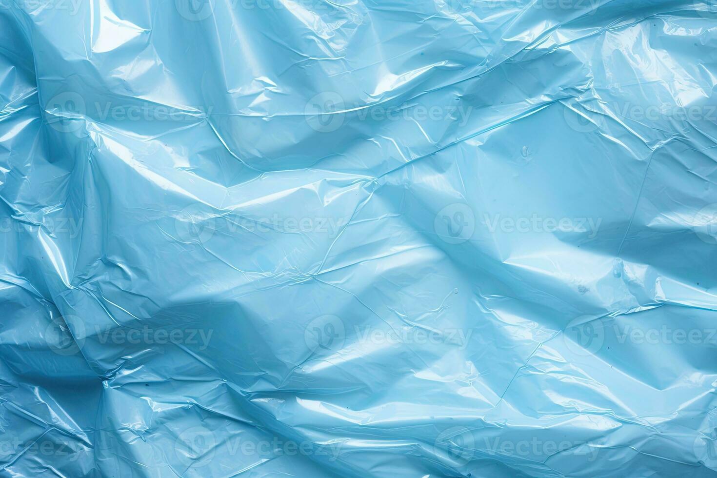 helder blauw plastic inpakken bedekking achtergrond. verfrommeld en gedrapeerd getextureerde cellofaan materiaal foto