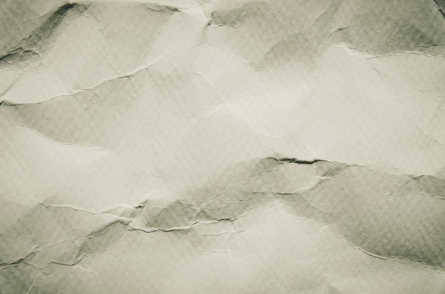witte achtergrond en behang door verfrommeld papier textuur. foto