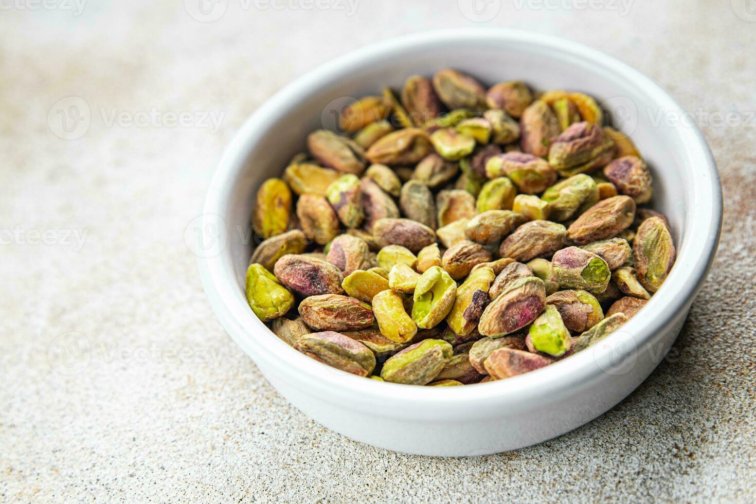 pistachenoten geschild noot gezond aan het eten Koken voorafje maaltijd voedsel tussendoortje Aan de tafel kopiëren ruimte voedsel achtergrond rustiek top visie foto