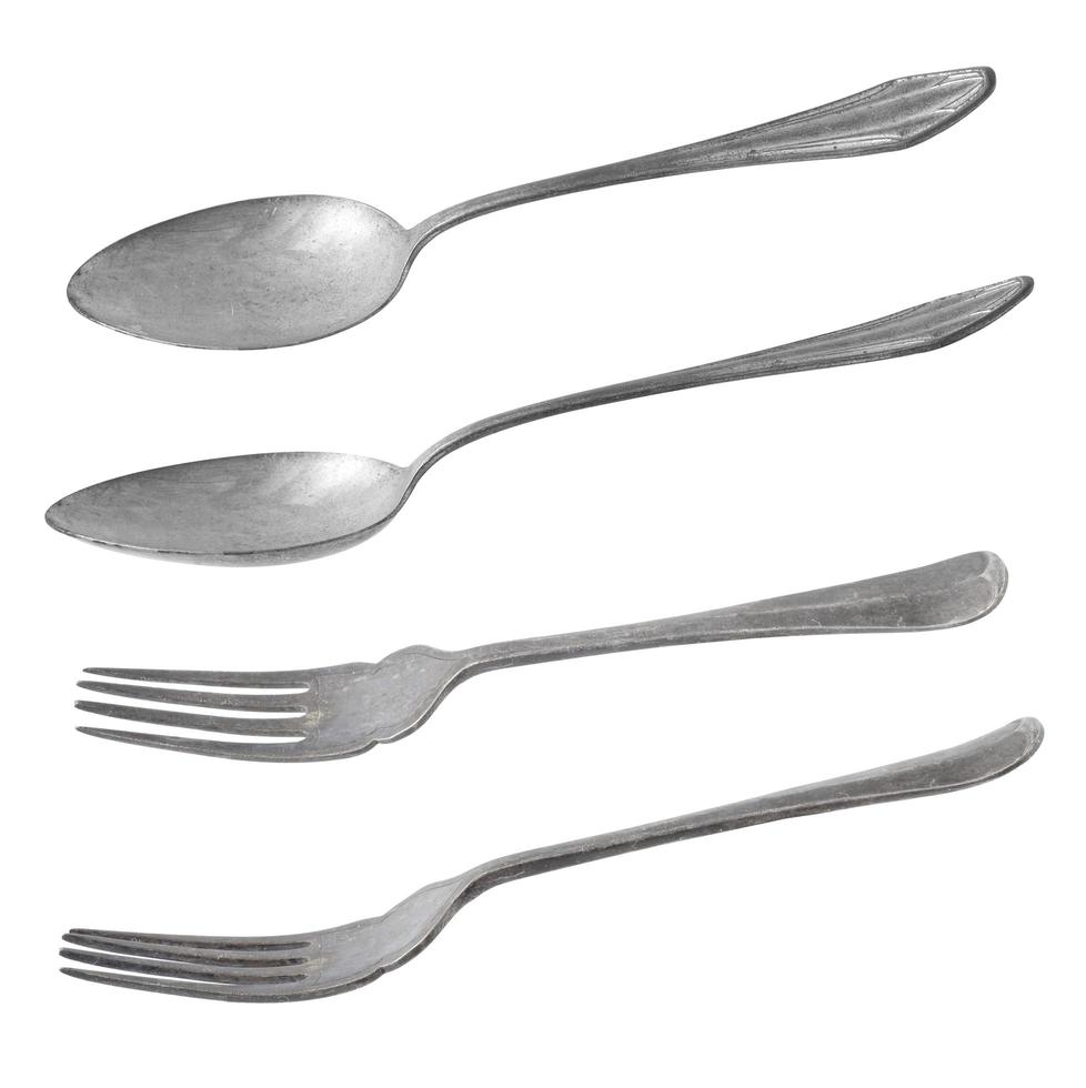 vintage metalen lepel en vork op witte achtergrond foto
