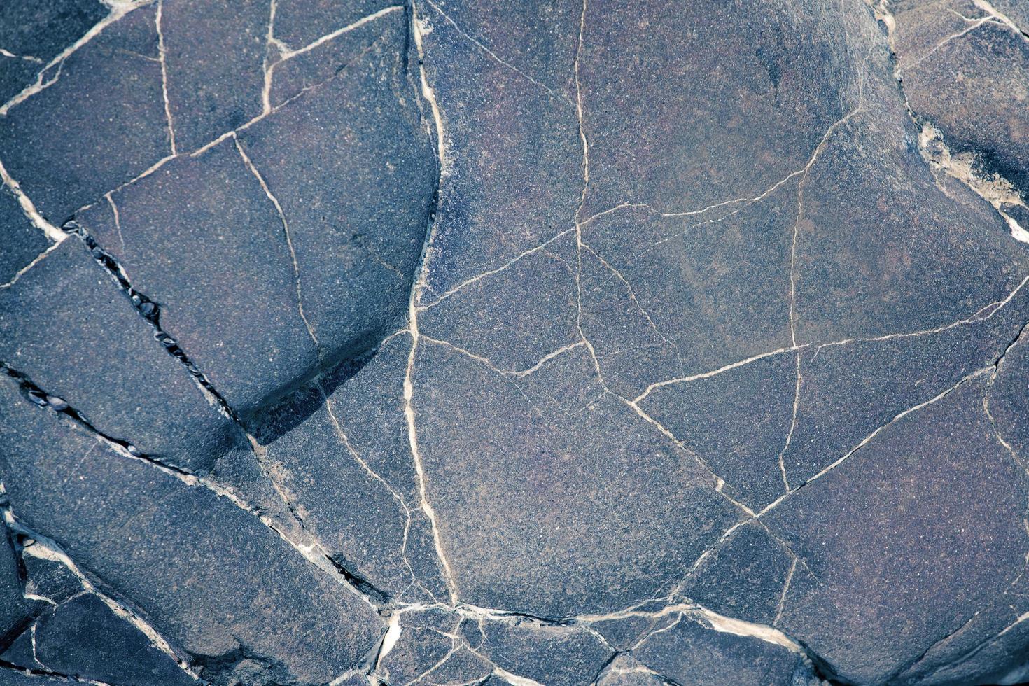 oppervlak van de grijsbruine steen foto