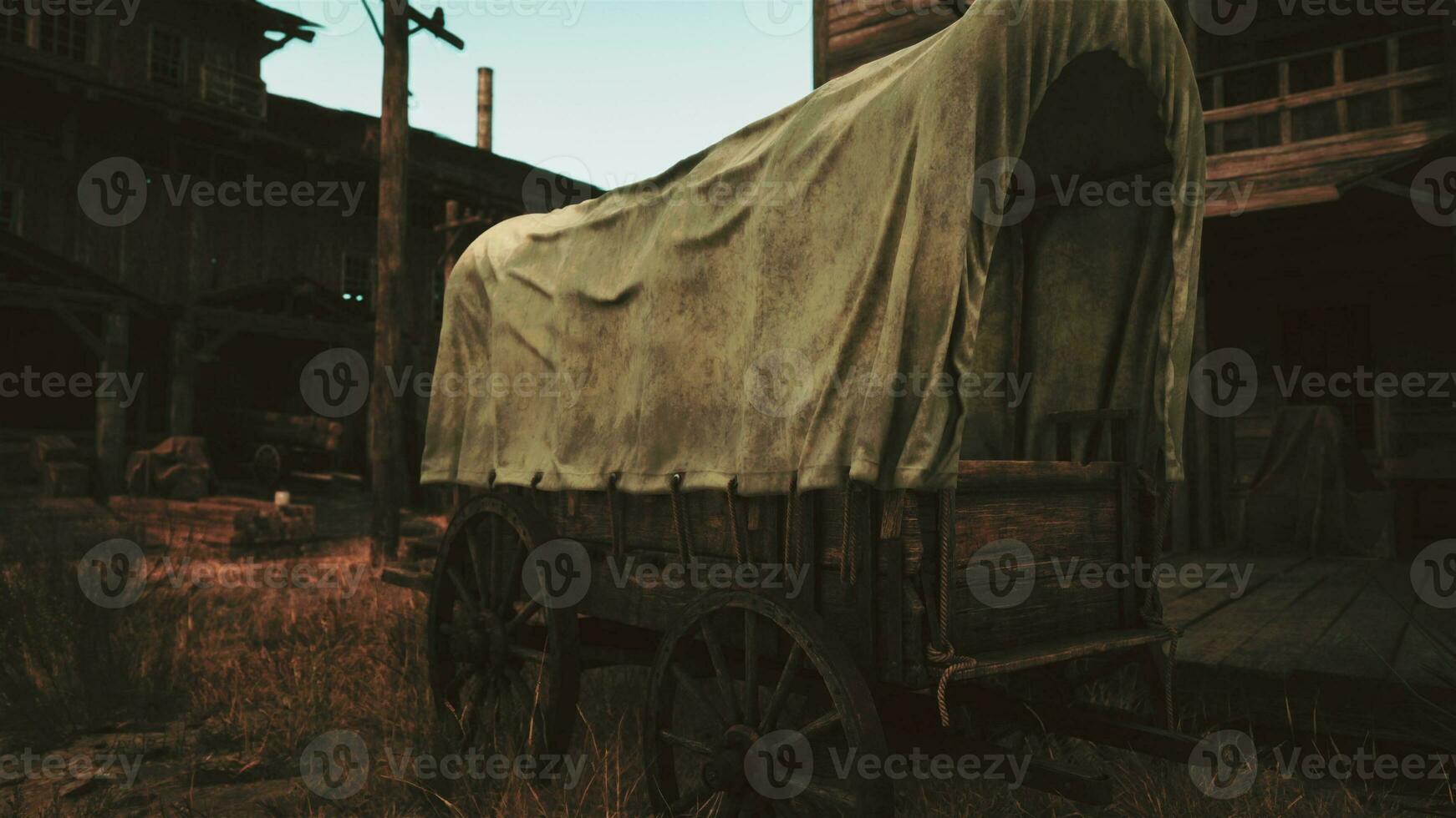 een rustiek gedekt wagon geparkeerd De volgende naar een charmant gebouw in een toneel- veld- foto