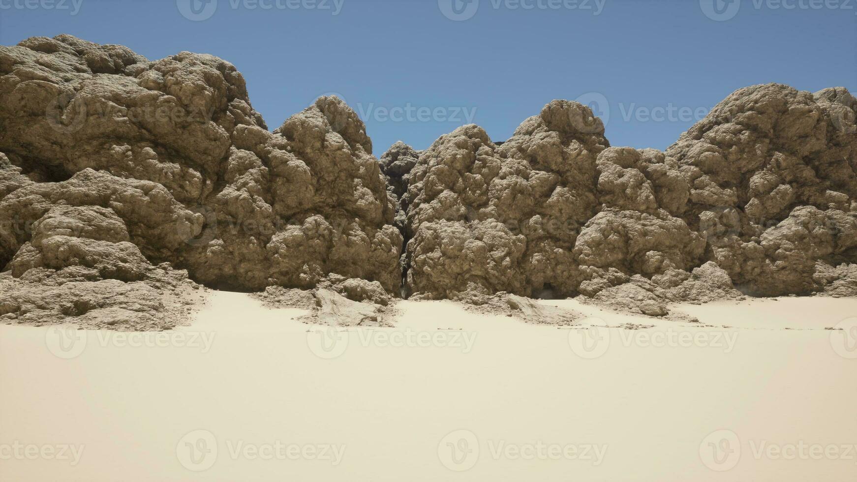 een groep van rotsen zittend in de midden- van een woestijn foto