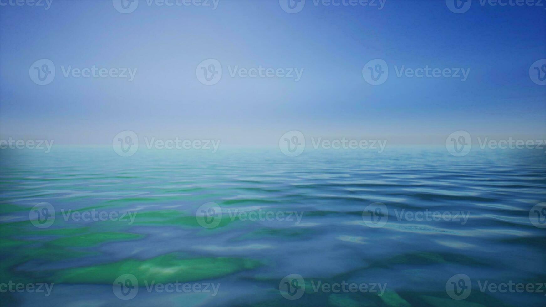 een schilderij van een lichaam van water met een blauw lucht in de achtergrond foto
