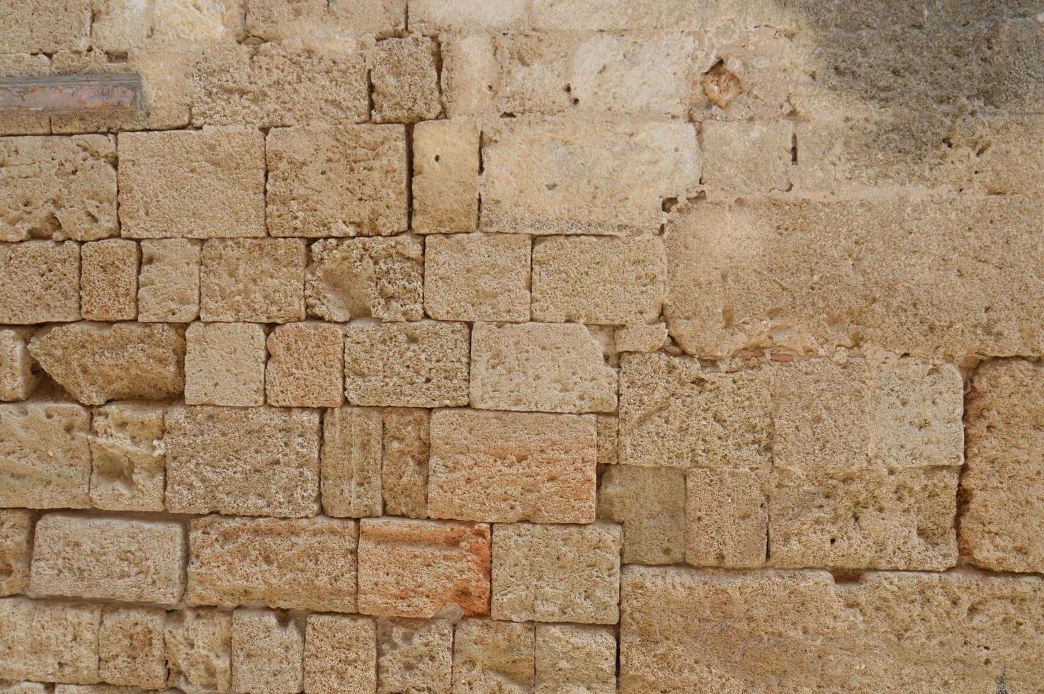textuur van oude metselwerkmuren op het eiland Rhodos in griekenland foto