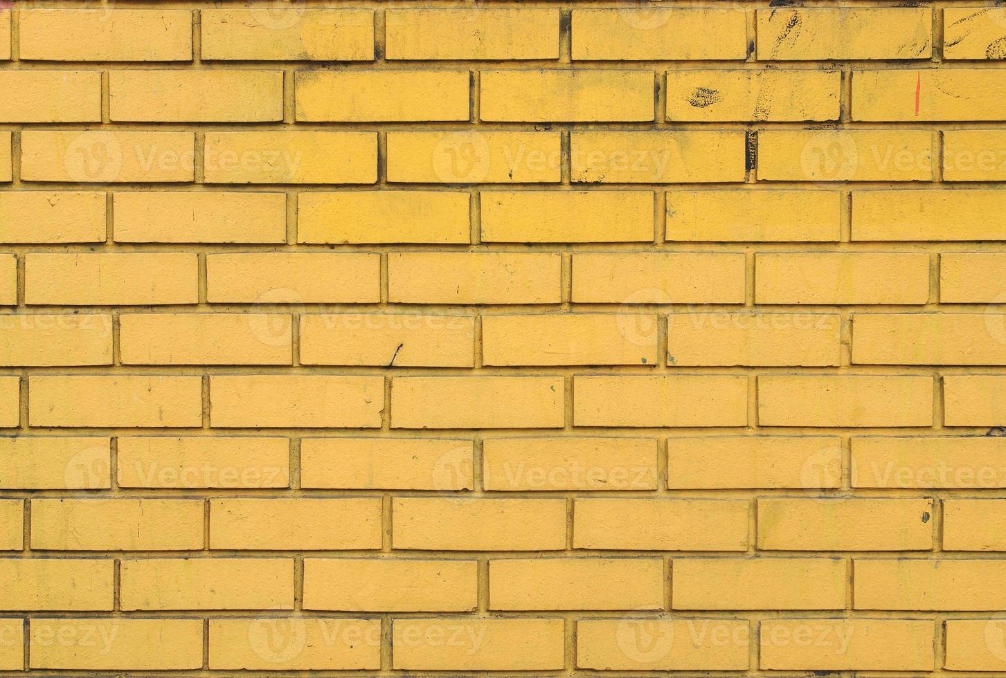 gele bakstenen muur achtergrond foto