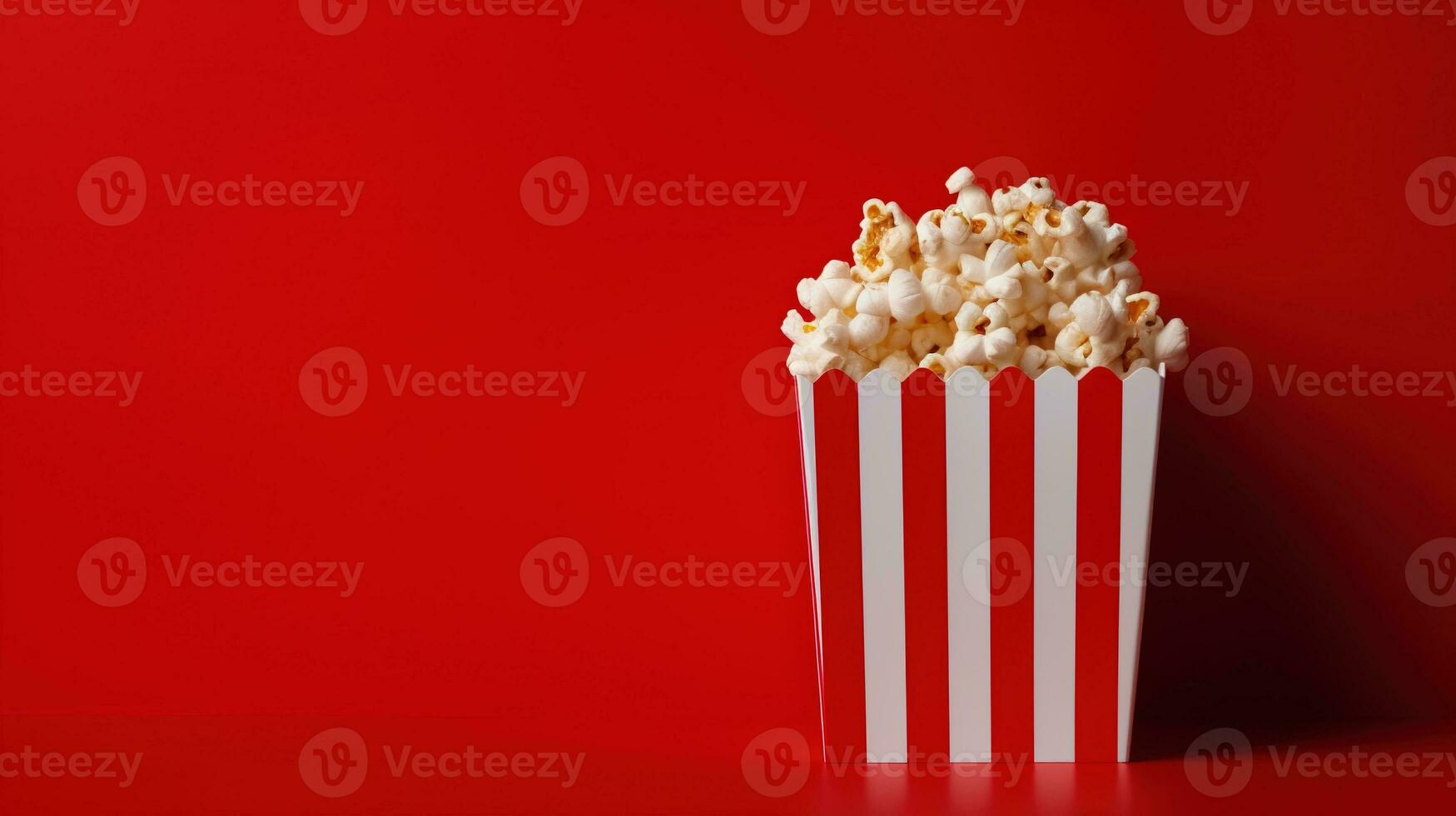 ai gegenereerd gestreept doos met popcorn Aan de rood achtergrond, kopiëren ruimte. tussendoortje, film, film, bioscoop foto