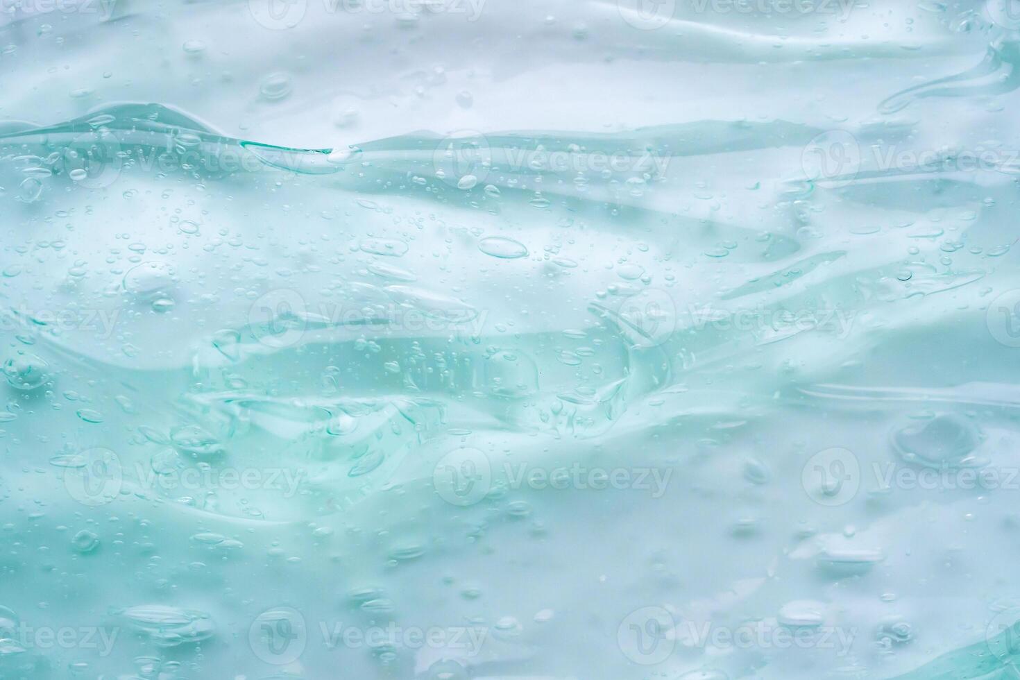 transparant Doorzichtig blauw vloeistof serum gel kunstmatig structuur achtergrond foto
