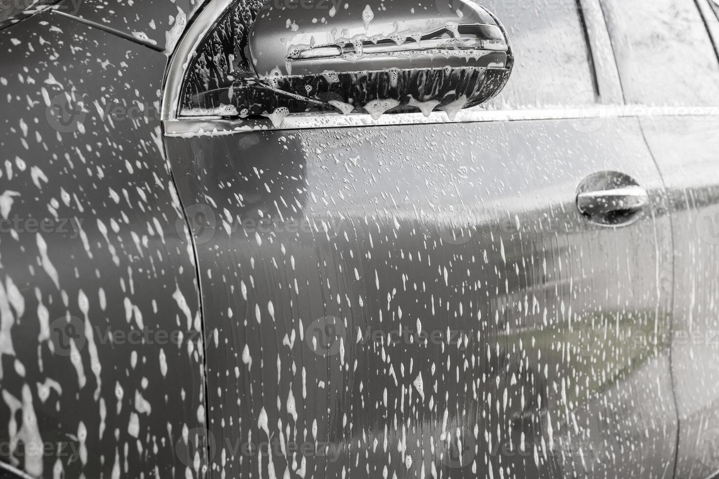 auto schoonmaak en het wassen met schuim zeep foto