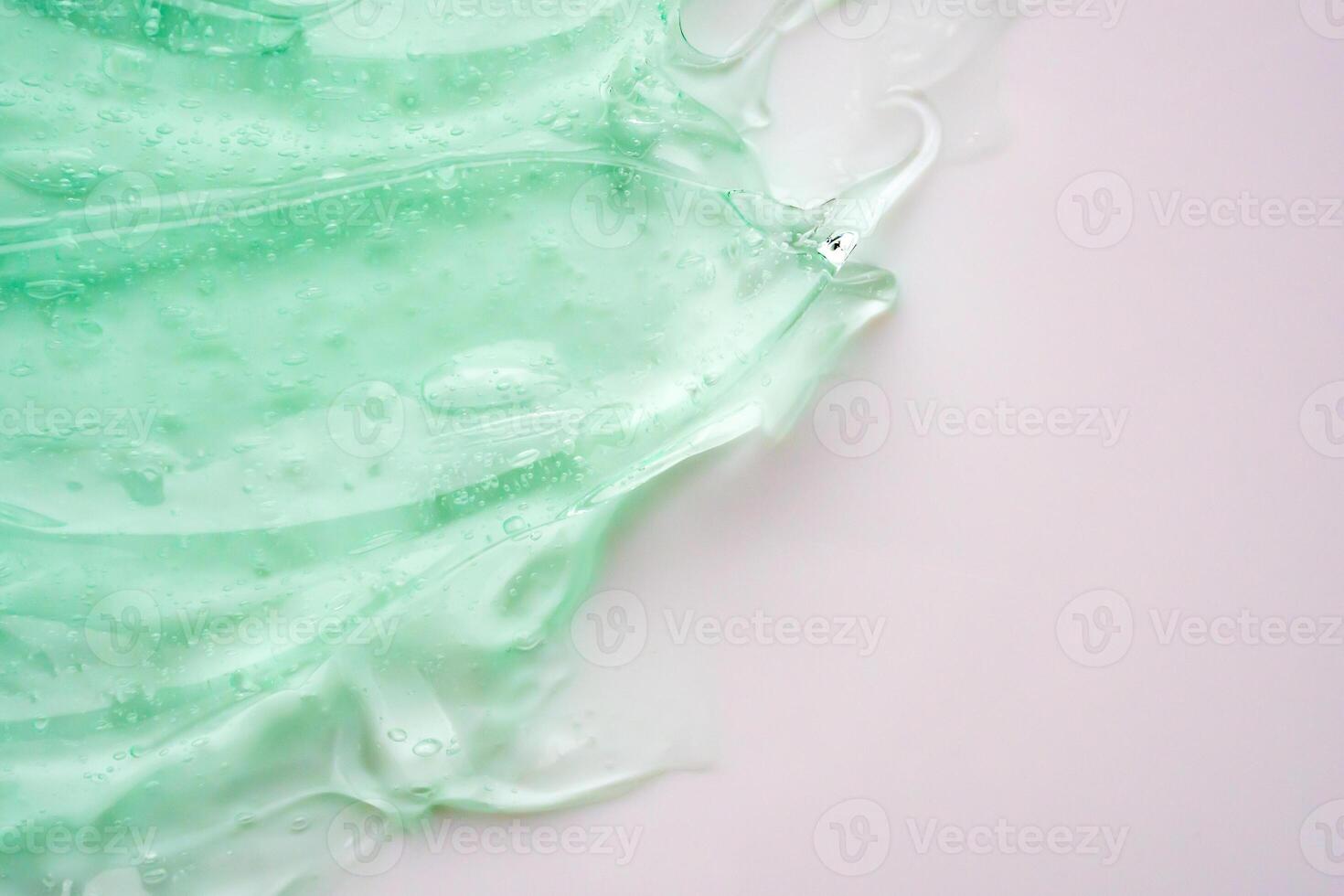 transparant Doorzichtig groen vloeistof serum gel kunstmatig structuur achtergrond foto