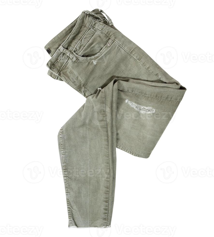 gevouwen kaki broek op witte achtergrond bovenaanzicht, mode, stijl concept - chino broek geïsoleerd op een witte achtergrond, kaki kleur, groene casual broek foto