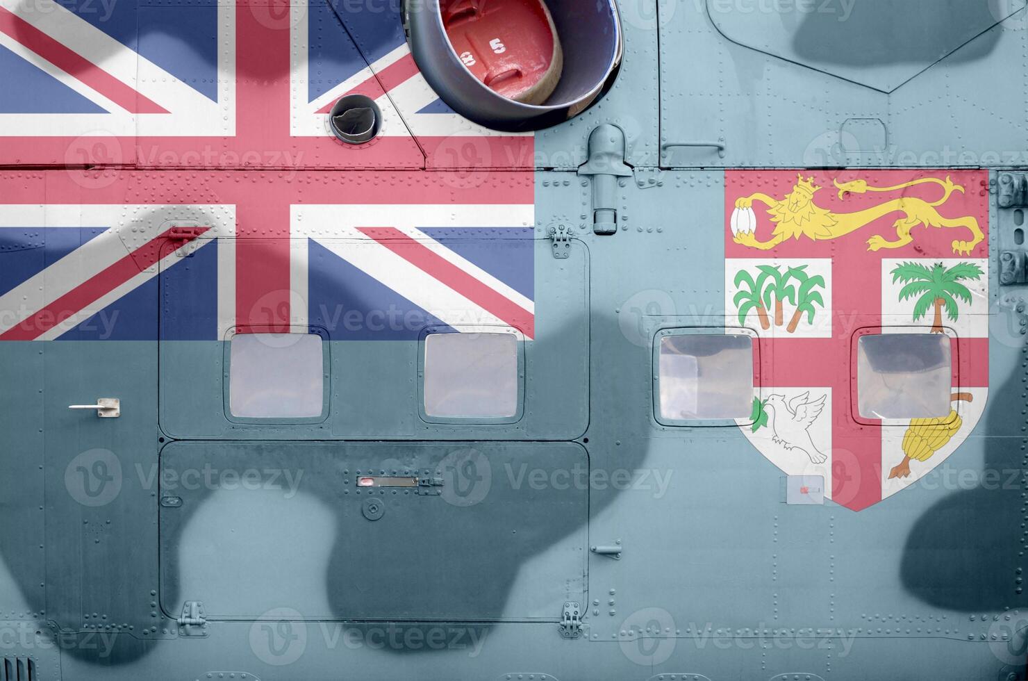 fiji vlag afgebeeld Aan kant een deel van leger gepantserd helikopter detailopname. leger krachten vliegtuig conceptuele achtergrond foto