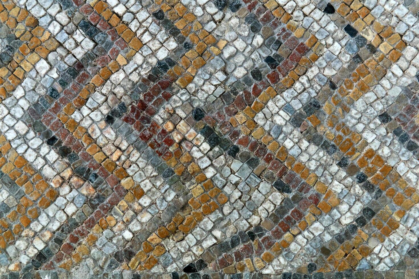 fragment van antiek mozaïek- verdieping met een patroon van tegels foto